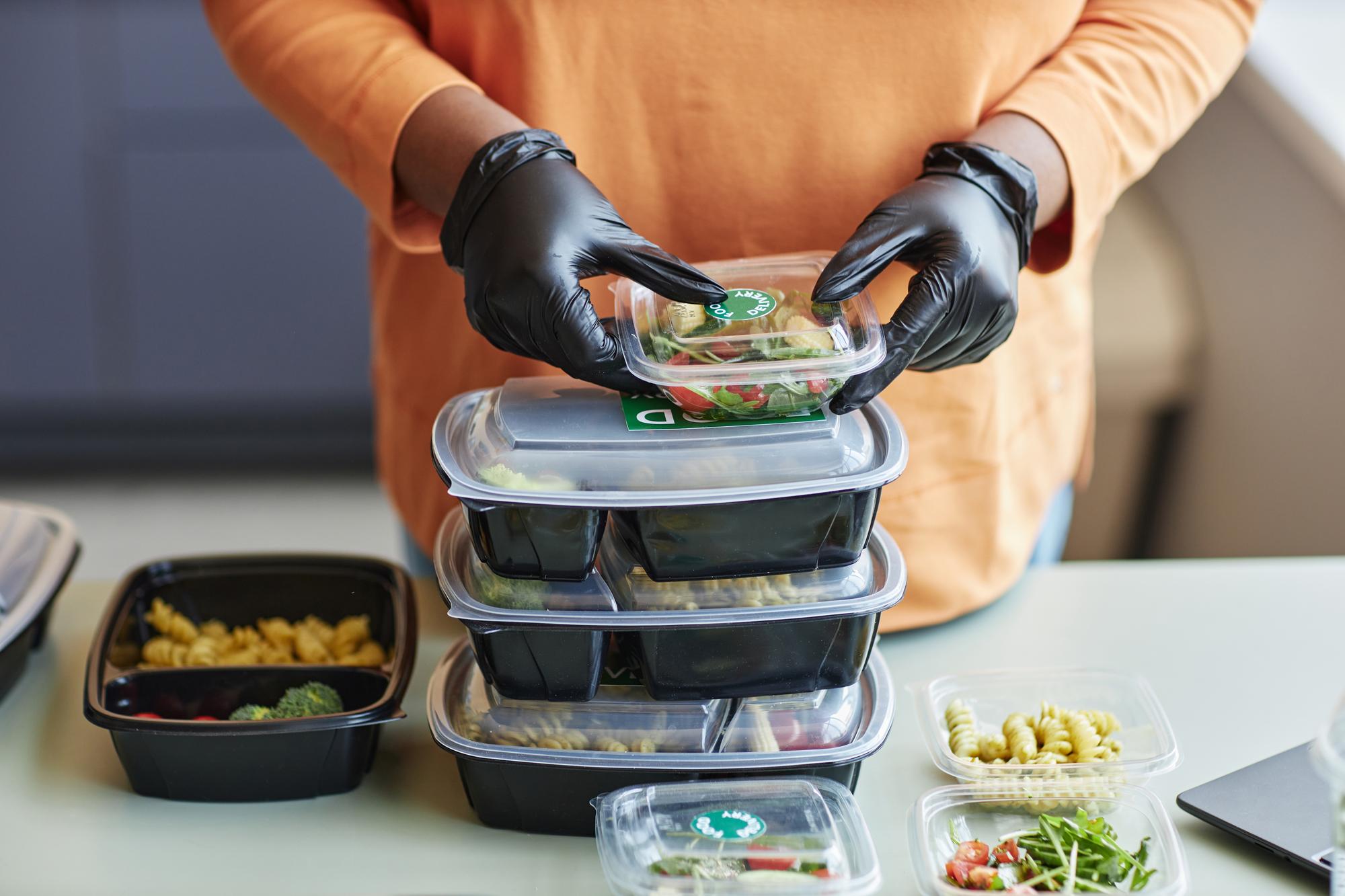 Stack of prepared meal boxes ready for pickup